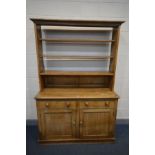 A 19TH CENTURY PINE DRESSER, with an open plate rack, two frieze drawers and panelled doors, width