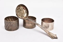 A LATE VICTORIAN SILVER LADLE AND THREE NAPKIN RINGS, the ladle with a textured tapered handle,