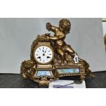 A 19TH CENTURY AND LATER GILT METAL FIGURAL MANTEL CLOCK, cast with a putti and fruiting vine, white