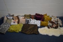 A LARGE COLLECTION OF CUSHIONS of various sizes, colours and styles together with three throws and a