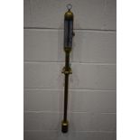 A BRASS MARINE STICK TYPE BAROMETER, unsigned, with a mounted thermometer, hanging loop and wall