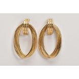 A PAIR OF 9CT GOLD HOOP EARRINGS, each designed with three intertwined gold wires of an oval drop