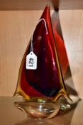 A MURANO OBALL TRI COLOUR GLASS YACHT, the sail in red, blue and amber with a clear base, bears