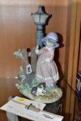 A LLADRO FIGURE, 'Fall Clean Up' (girl with rake near lampost) No.5286, issued in 1985 and retired