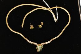 AN 18CT GOLD EMERALD AND DIAMOND NECKLACE AND A PAIR OF 18CT GOLD EMERALD STUD EARRINGS, the central