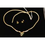 AN 18CT GOLD EMERALD AND DIAMOND NECKLACE AND A PAIR OF 18CT GOLD EMERALD STUD EARRINGS, the central