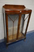 AN ART DECO ASTRAGAL GLAZED TWO DOOR CHINA CABINET, with glass shelves, width 74cm x depth 31cm x