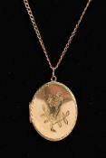 A 9CT GOLD LOCKET NECKLACE, the locket of an oval form, engraved floral design to the front, opens