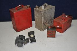 A TRAY CONTAINING THREE VINTAGE FUEL CANS, an oil can and two vintage cycle lights, including a