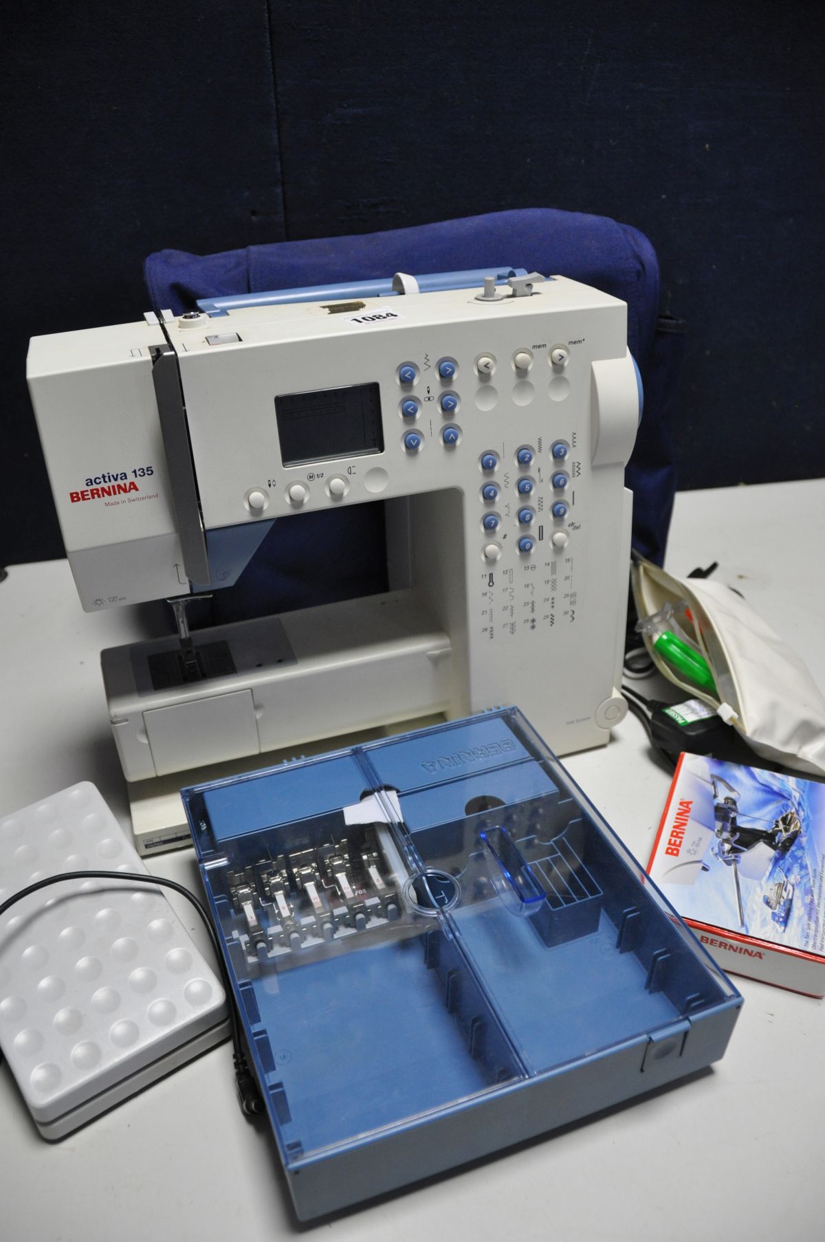 A BERNINA ACTIVA 135 SEWING MACHINE with power cable, footswitch,