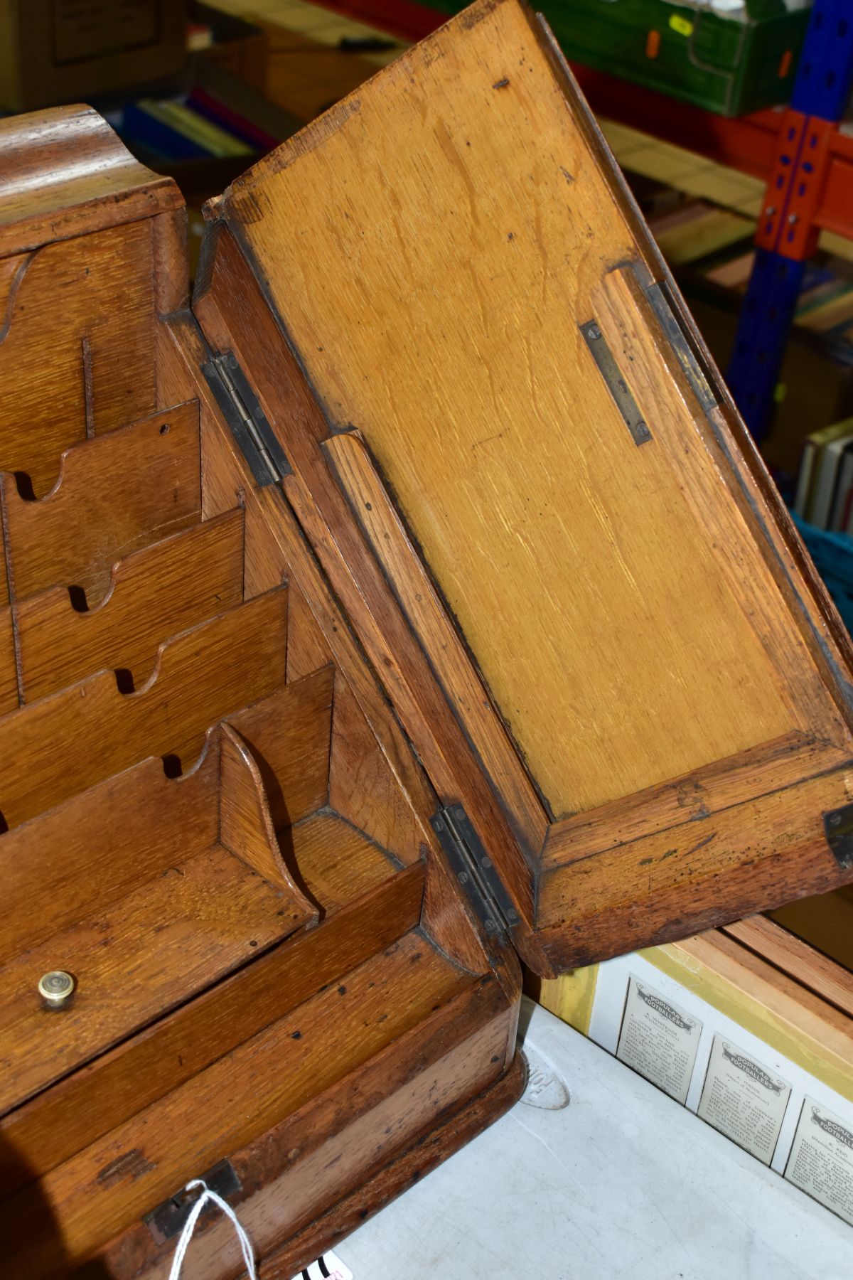 AN EDWARDIAN OAK STATIONERY BOX, hinged top above sloped double doors opening to reveal a fitted - Image 4 of 7