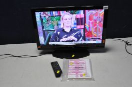 A SHARP LC-22DV 22in LCD TV with manual and remote (PAT pass and working) and a black glass TV Stand