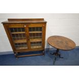 AN EARLY TO MID 20TH CENTURY OAK LEAD GLAZED DOUBLE DOOR BOOKCASE with two adjustable shelves