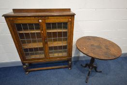 AN EARLY TO MID 20TH CENTURY OAK LEAD GLAZED DOUBLE DOOR BOOKCASE with two adjustable shelves