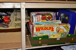 FOUR BOXES AND LOOSE CHILDRENS TOYS, GAMES, JIGSAWS etc, comprising of a green plastic trunk