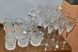 A SUITE OF STUART CRYSTAL DRINKING GLASSES AND A STUART CRYSTAL DECANTER, the decanter of bell shape