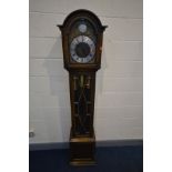 AN OAK LONGCASE CLOCK, with an arched hood, glazed door enclosing an 8.5 ins dial, Tempus Fugit to