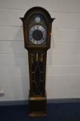 AN OAK LONGCASE CLOCK, with an arched hood, glazed door enclosing an 8.5 ins dial, Tempus Fugit to