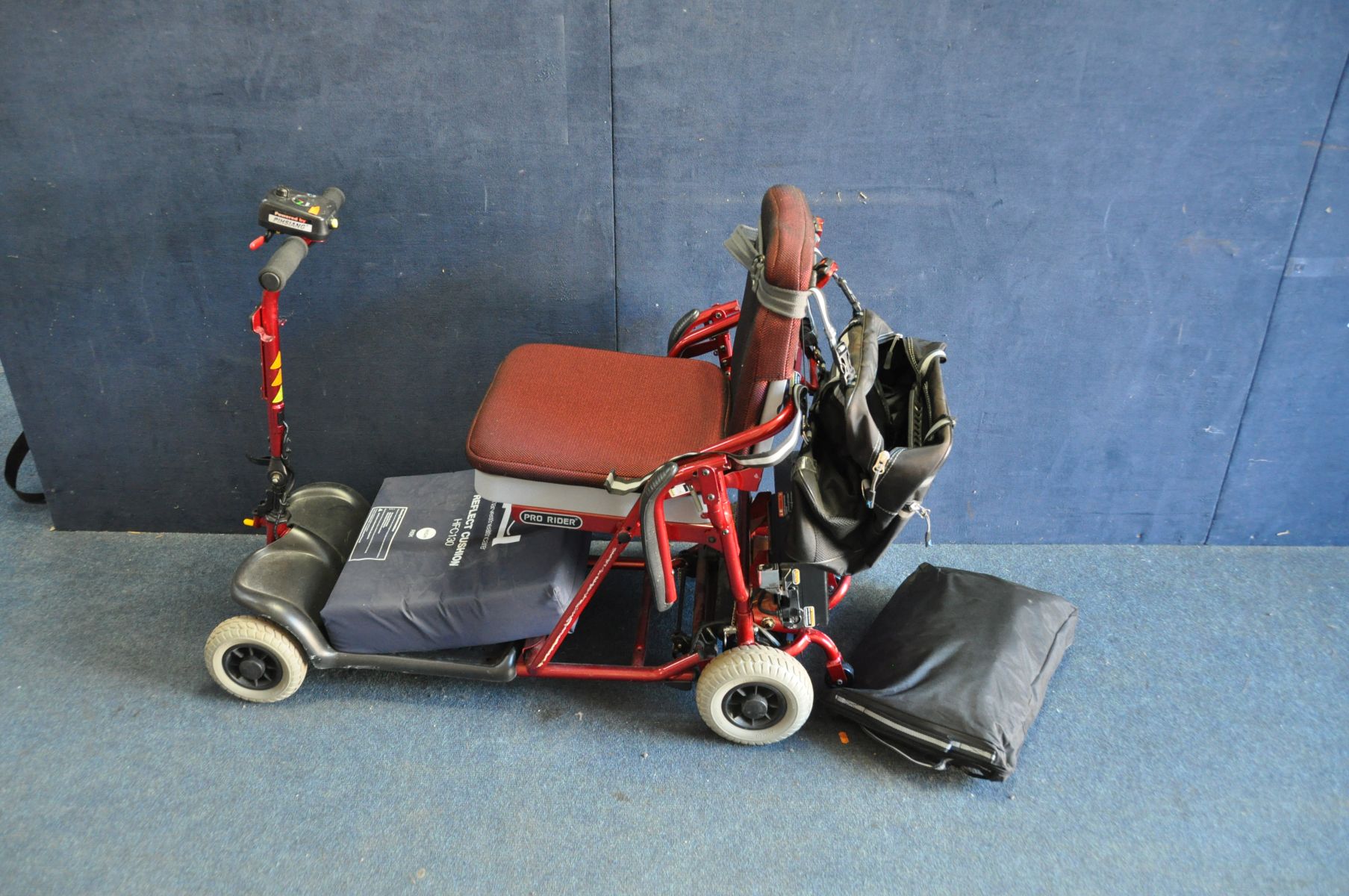 A PRO RIDER TE-FS4 FOLDING DISABILITY SCOOTER with charger and rain cover