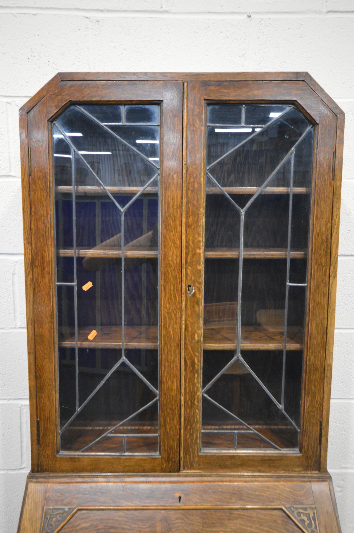 A EARLY TO MID 20TH CENTURY OAK BUREAU BOOKCASE, the top section with Art Deco lead glazed doors, - Image 3 of 3