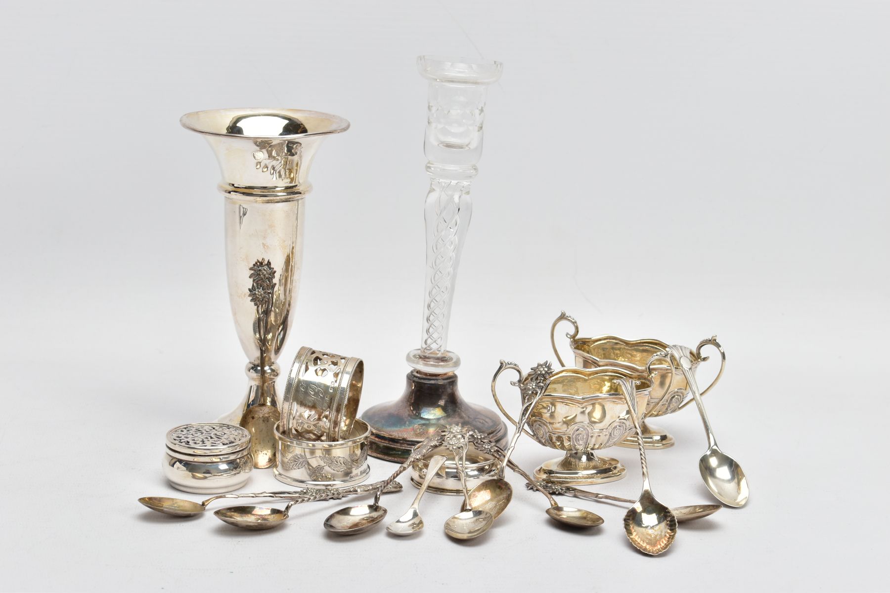 A SELECTION OF SILVERWARE, to include a silver bud vase, a further glass and silver bud vase, both