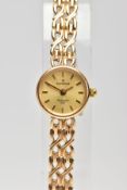 A LADY'S 9CT GOLD WRISTWATCH, quartz movement, round gold dial signed 'Sovereign', baton markers,