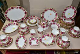 A QUANTITY OF ROYAL ALBERT OLD ENGLISH ROSE TEA AND DINNERWARES, comprising five tea cups (one