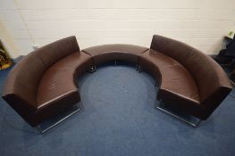 A KOINOR BROWN LEATHER THREE SECTION CURVED SOFA BENCH, comprising two benches with backs, one