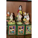 A SET OF EIGHT BOXED ROYAL DOULTON 'WALT DISNEY'S CLASSIC SNOW WHITE AND THE SEVEN DWARFS',
