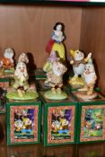 A SET OF EIGHT BOXED ROYAL DOULTON 'WALT DISNEY'S CLASSIC SNOW WHITE AND THE SEVEN DWARFS',