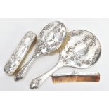 A FOUR PIECE SILVER VANITY SET, to include a hairbrush, clothes brush, comb and a handheld mirror,