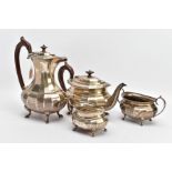 A FOUR PIECE GEORGE.V SILVER TEA SET, to include a teapot and hot water jug each of a faceted George