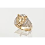 A GENTS 9CT RING, bi-coloured design in the form of a realistically textured lions head, set with