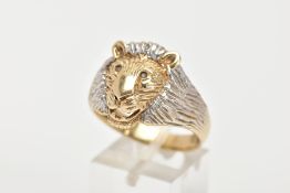 A GENTS 9CT RING, bi-coloured design in the form of a realistically textured lions head, set with