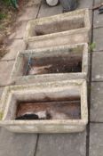 THREE RECTANULAR COMPOSITE GARDEN PLANTERS with Horological figures etched on each facet, width 73cm