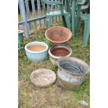 FOUR GARDEN PLANT POTS AND A DECORATIVE DISC including a Terracotta Pancheon 38cm in diameter, an