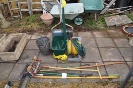 A QUANTITY OF GARDEN ITEMS including two lawn seed spreader, a hose reel, garden tools, a Galvanised