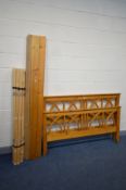 A PINE 4FT6 BEDSTEAD with side rails and slats (missing screws)