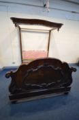 A VICTORIAN MAHOGANY 5ft HALF-TESTER BEDTSEAD, a wavy canopy, later upholstered headboard, pine