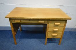 A MID 20TH CENTURY OAK DESK with four assorted drawers, width 123cm x depth 69cm x height 78cm