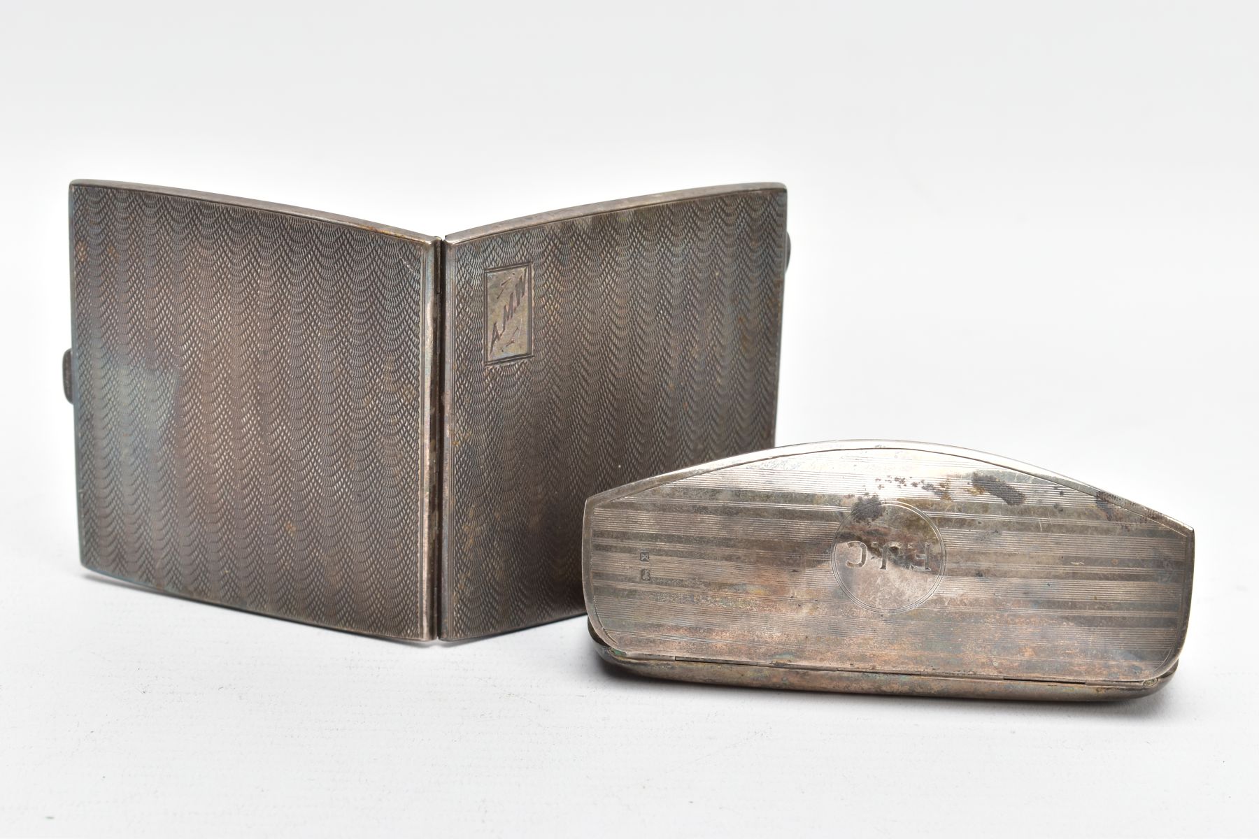 A SILVER CIGARETTE CASE AND GLASSES CASE, the cigarette case of an engine turned design, engraved