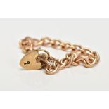 A 9CT GOLD CHARM BRACELET, curb link bracelet fitted with a heart clasp hallmarked 9ct gold