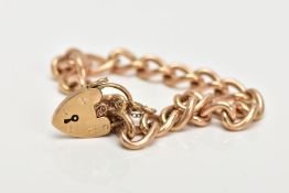 A 9CT GOLD CHARM BRACELET, curb link bracelet fitted with a heart clasp hallmarked 9ct gold