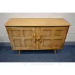 AN ERCOL 1950'S ELM AND BEECH DOUBLE DOOR SIDEBOARD, with panelled doors and sides, on turned