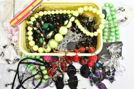 A SMALL BOX OF ASSORTED COSTUME JEWELLERY, beaded necklaces, bracelets and earrings (some new