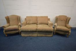 A DURESTA STYLE THREE PIECE LOUNGE SUITE, stripped red and gold upholstery, comprising a sofa,