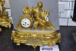 A MID 19TH CENTURY FRENCH GILT METAL AND ALABASTER FIGURAL MANTEL CLOCK, the classical figure seated