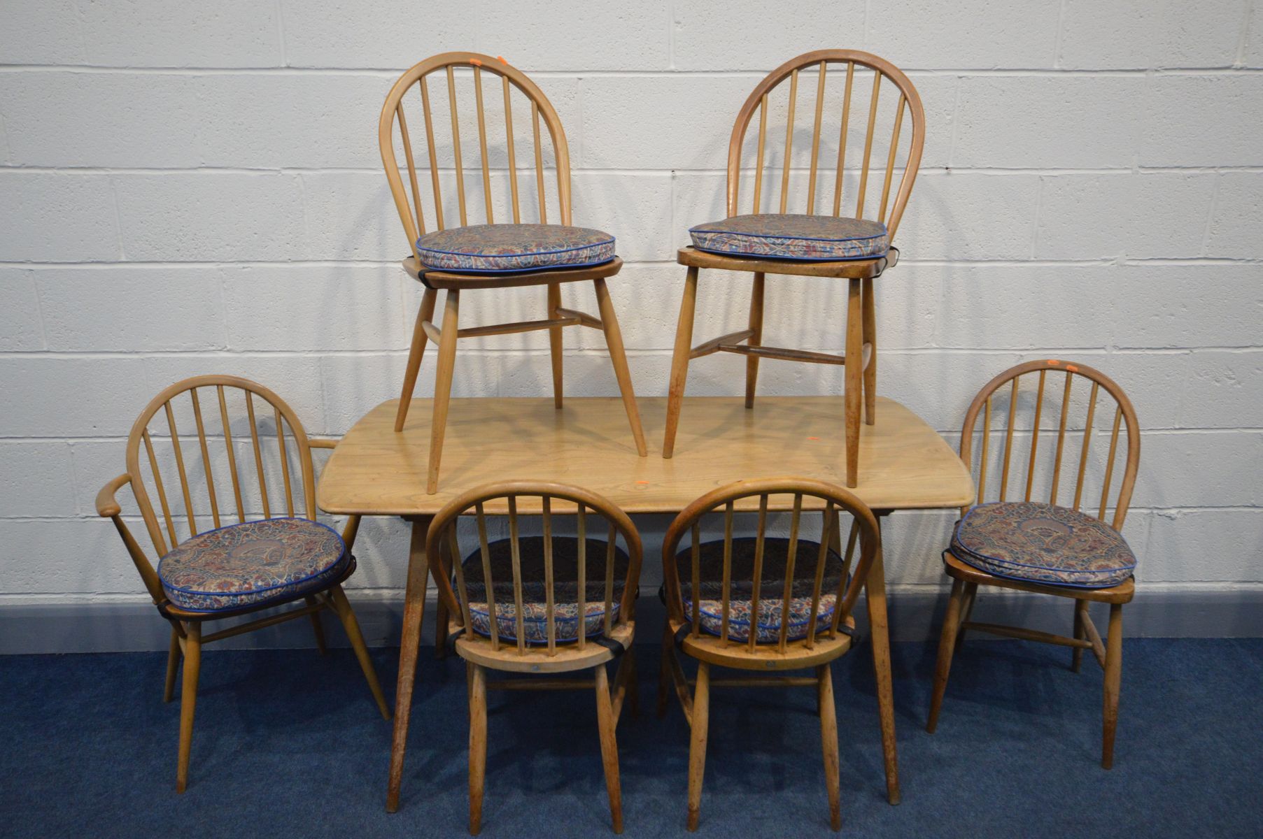 AN ERCOL ELM AND BEECH MODEL 382 DINING TABLE, on square tapering legs, length 138cm x depth 71cm