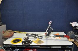 A KAWASAKI KBH26A PETROL STRIMMER with manual, strap and some spare parts (engine pulls freely and