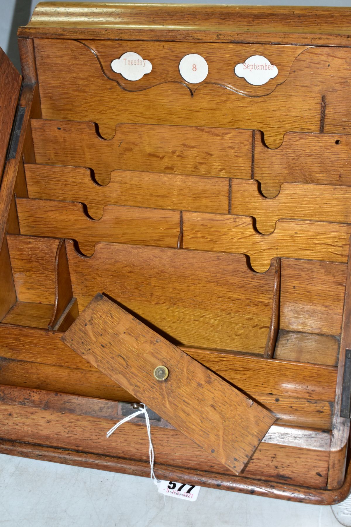 AN EDWARDIAN OAK STATIONERY BOX, hinged top above sloped double doors opening to reveal a fitted - Image 3 of 7